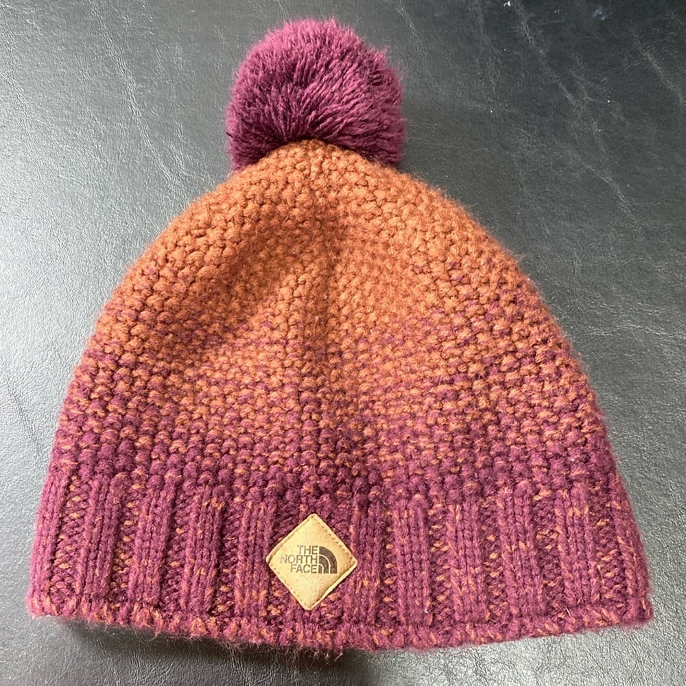 The North Face Woman’s Plum and Rust Ombre’ Beanie Hat With Pom Pom. OSFA